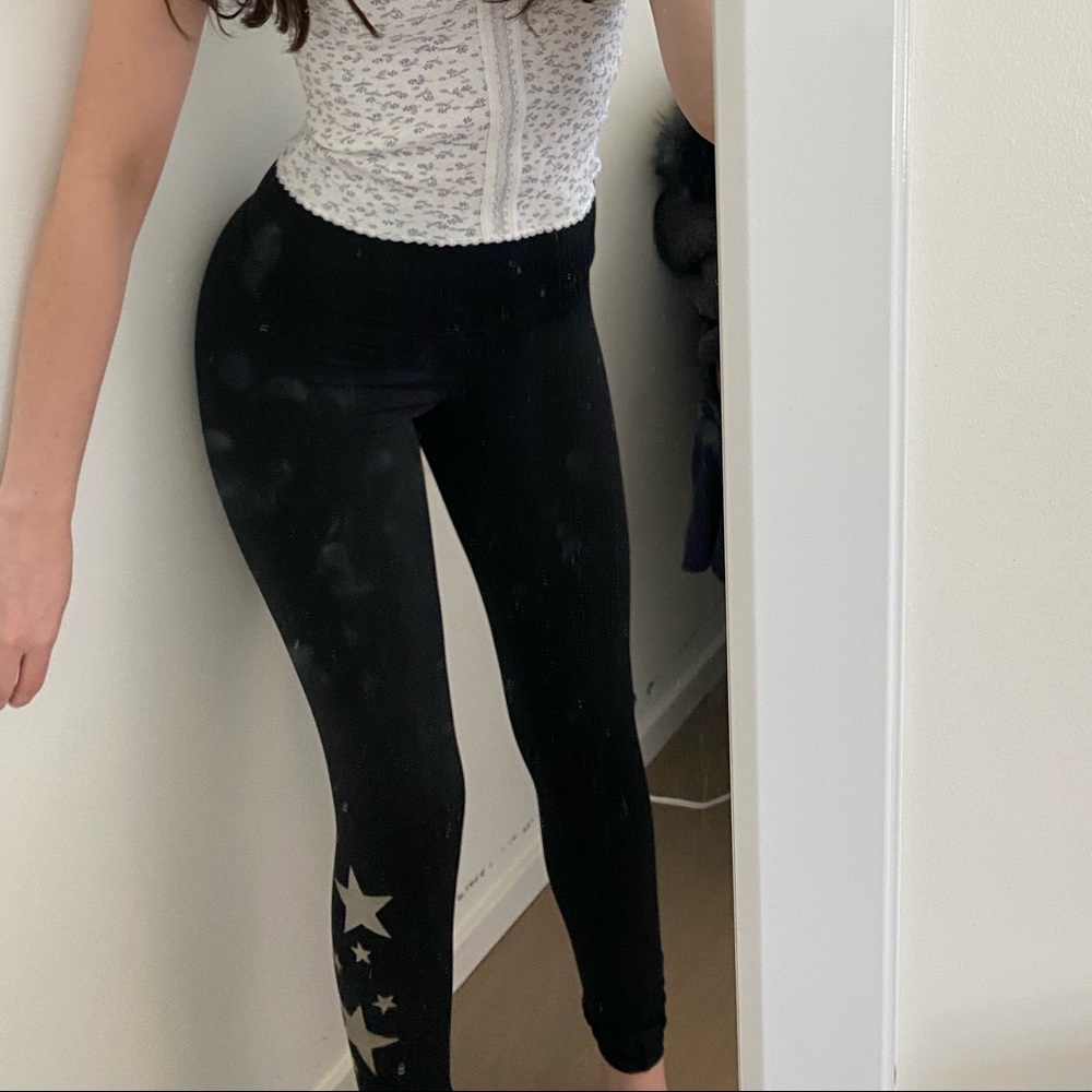 Mid-rise black leggings with gold metallic stars. Bought for around $100.